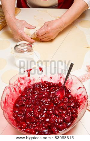 Cooking ukrainian varenyky with cherries. Serie.