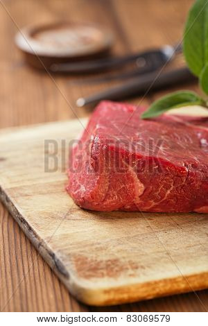 raw beef meat fillet  on wooden  table closeup