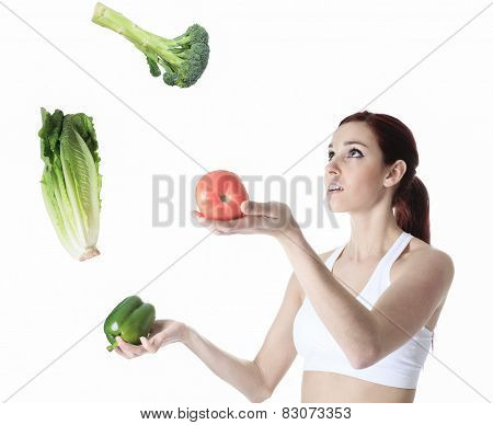 Woman juggle vegetable