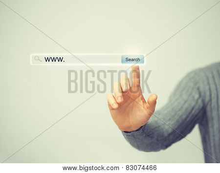 technology, searching system and internet concept - male hand pressing Search button