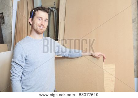 A carpenter working hard at the worksop