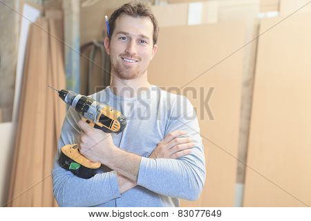 A carpenter working hard at the worksop