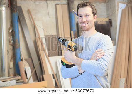 A carpenter working hard at the worksop