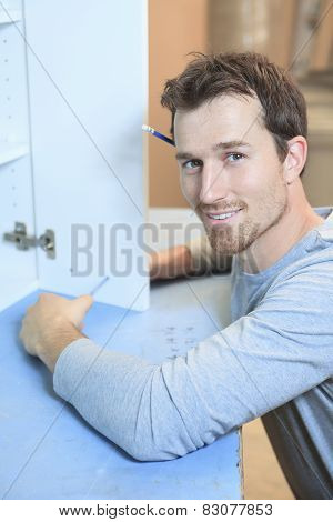 A carpenter working hard at the worksop