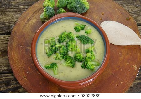 appetizing  broccoli soup on dark wooden background