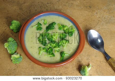 broccoli soup on a brown stone background
