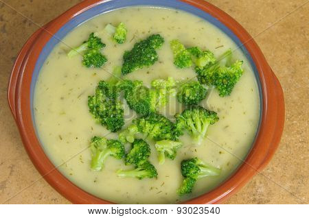 broccoli soup on a brown stone background
