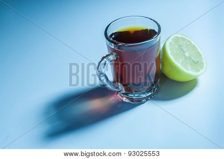 Glass of black tea and slice of lemon