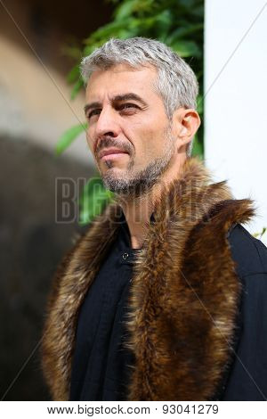 Portrait Of A Sexy Man In Wolf  Fur, Looking Out Into The Distance.