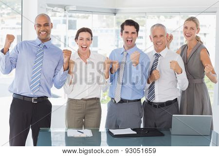 Business team celebrating a good job in the office