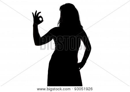 Image of woman's silhouette showing okey