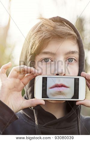 Virtual Realty, Teenage Boy Holding A Smart Phone In Front Of His Face