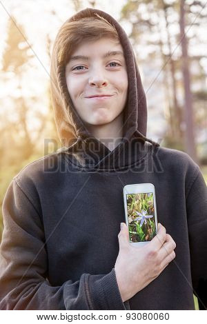 Virtual Realty, Teenage Boy Holding A Smart Phone In Front Of His Heart