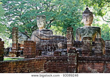 Old Buddha Statue With Green Leaf Background At Wat Phra Kaeo In Kamphaeng Phet