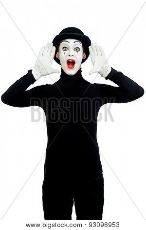 Male mime artist is shouting or calling someone. Isolated over white.
