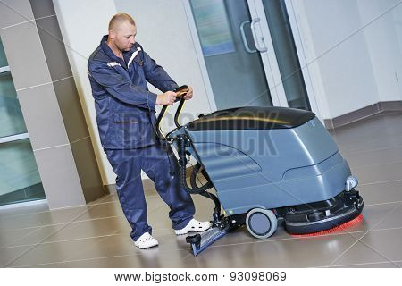Floor care and cleaning services with washing machine in business centre hall