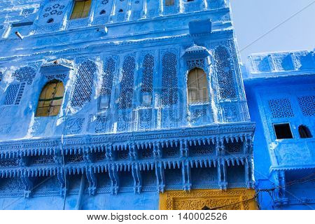 Traditional blue windows and wall in Blue City Jodhpur, India.