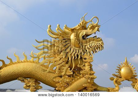 two big statue of golden dragon at Buddhist Chau Thoi temple Binh Duong Vietnam