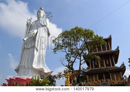 big statue of Bodhisattva at Buddhist Chau Thoi temple Binh Duong Vietnam