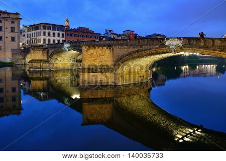 FLORENCE, ITALY - APRIL 27: Ponte Santa Trinita bridge over the Arno River shown on April 27, 2013 in Florence, Italy. The Ponte Santa Trinita is the oldest elliptic arch bridge in the world