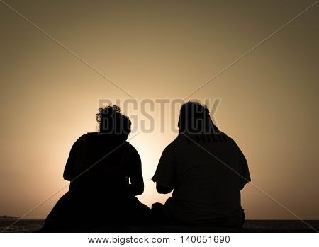 Sungaze from a couple on the beach