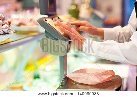 Shopkeeper cheking the food weight