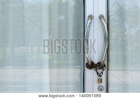 Door handles, stainless steel chain with a lock.