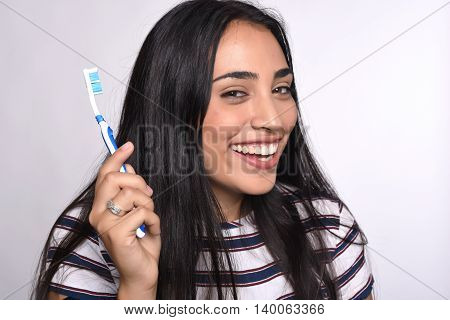 Close-up woman brushing her teeth. Isolated white background.