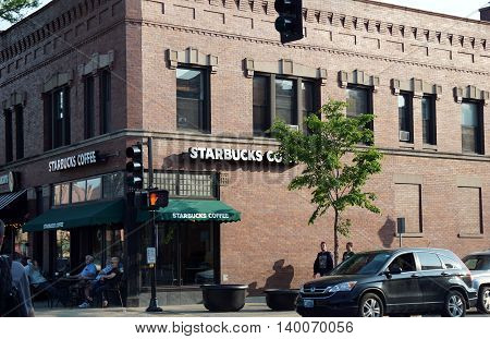 LA GRANGE, ILLINOIS / UNITED STATES - MAY 21, 2016: One may drink Starbucks Coffee in downtown La Grange, Illinois.