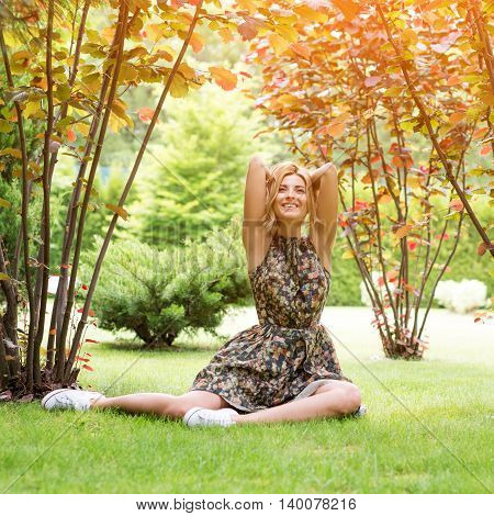 Young woman relaxing on a beautiful green meadow