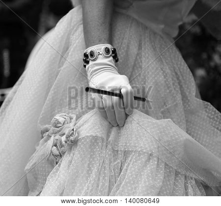 Gloved Hand On The Elegant Lady With The Cigarette Holder