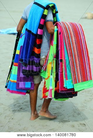 Pedlar Of Cloth And Towels On The Beach