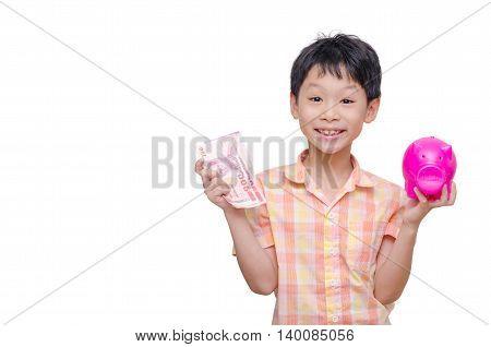 Little asian boy with banknote and piggy bank