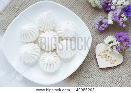 Meringue - the Traditional French dessert on a light background close up the top view
