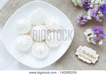 Meringue - the Traditional French dessert on a light background close up the top view