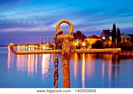 Rusty anchor view at blue evening by the sea Zadar Croatia