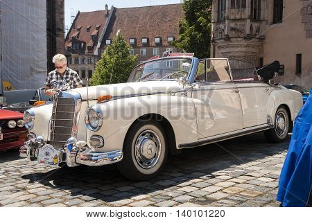 Nurnberg Bavaria / Germany - July 19th 2014: white vintage Mercedes Benz cabriolet at Sud - Rallye- Historic event in Nurnberg