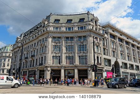 LONDON - JULY 1 2014: Nike town the famous sports store on Oxford circus in London. Up to over 40.000 pedestrians per hour pass the junction it is the highest pedestrian volumes recorded in London.