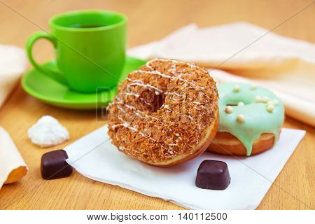 Delicious donuts and cup of coffee morning sweet breakfast