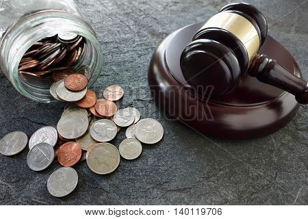 Coins from a coinjar and legal gavel