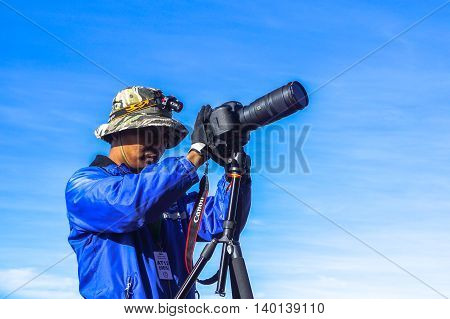 Ranau,Sabah,Malaysia-March 13,2016:Undentified of a photographer framing a shot, taking pictures beautiful view on summit Mountain Kinabalu,Ranau,Sabah.