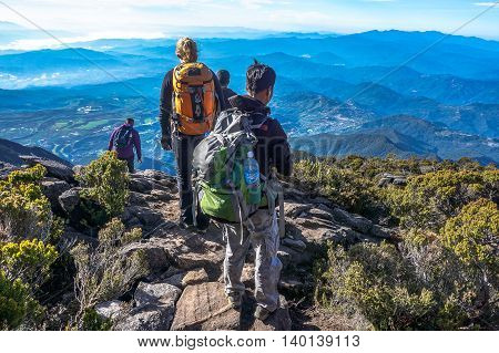 Ranau,Sabah,Borneo-March 13,2016:Group of climbers move down from Low's Peak to Laban Rata check point at Mountain Kinabalu on 13th Mac 2016.There are two summit trails,Ranau Trail & Kota Belud Trail