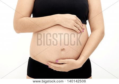 Beautiful pregnant woman detail on white background
