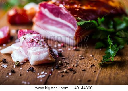 Bacon. Smoked bacon parsley herb salt pepper and garlic.Stll life studio shot.