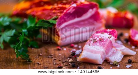 Bacon. Smoked bacon parsley herb salt pepper and garlic.Stll life studio shot.