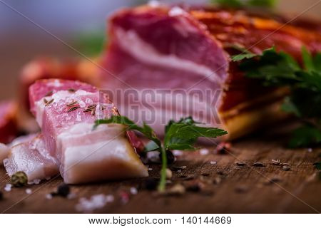 Bacon. Smoked bacon parsley herb salt pepper and garlic.Stll life studio shot.