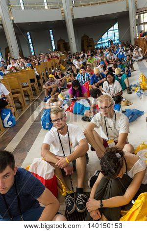 CRACOW POLAND - JULY 26 2016: World Youth Day 2016 - Crowd of Pilgrims inside of the Sanctuary of Divine Mercy in Lagiewniki. Cracow Poland