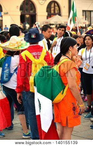 KRAKOW POLAND - JUL 27 2016: World youth day 2016.International Catholic youth Convention. Young people on Main Square in Krakow.