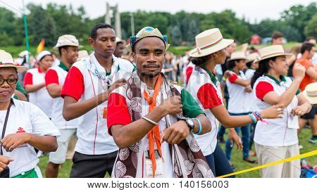 Poznan POLAND - JULY 24 2016: pilgrims praying dancing and singing during Days In Dioceses just before The World Youth Day in Krakow; WYD is a meeting of youth from all over the world