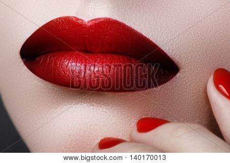 Close-up Of Woman's Lips With Fashion Make-up And Manicure. Beau
